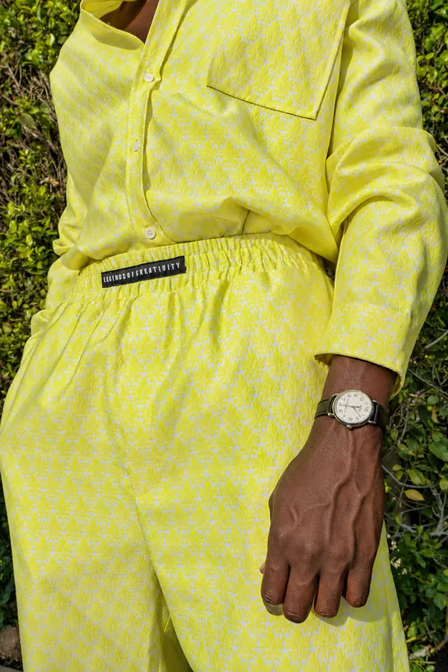 Close detail of yellow fabric and a hand