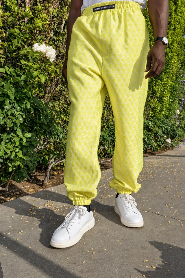Detail of yellow trousers and shoes