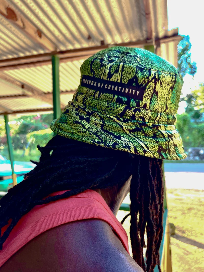 Rear view of a model in a snakeskin-print bucket hat