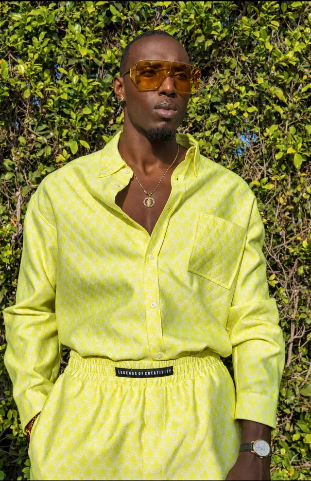 Portrait of a model in a yellow patterned outfit
