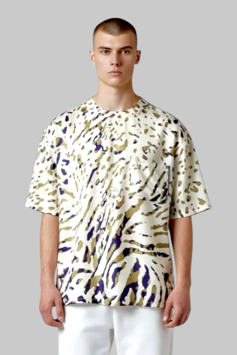 Legends of Creativity James Abstract Animal print silk short sleeve top with relaxed fit and drop shoulder. Cream with green and blue pattern.